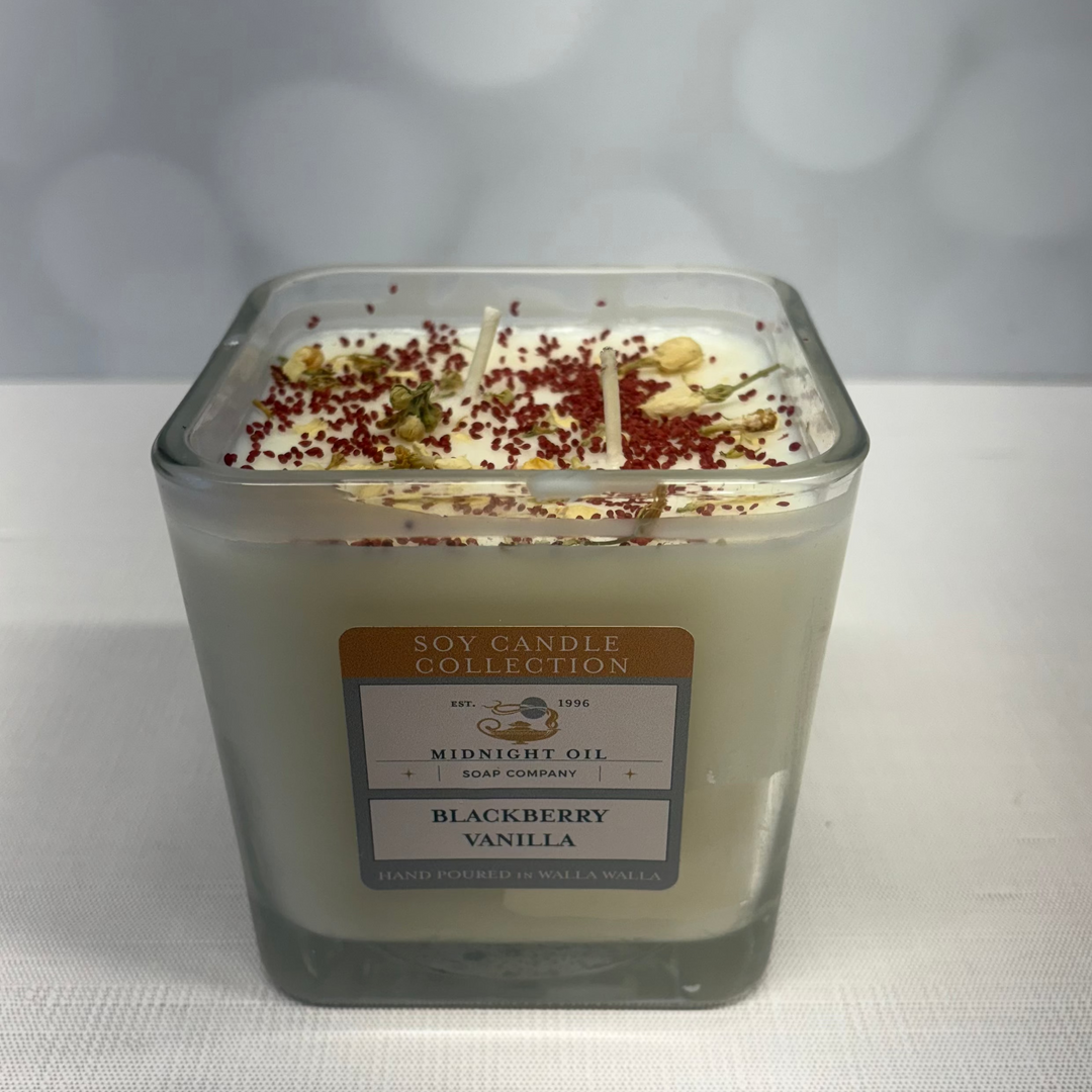 Soy candle with a label on a white surface and gray background