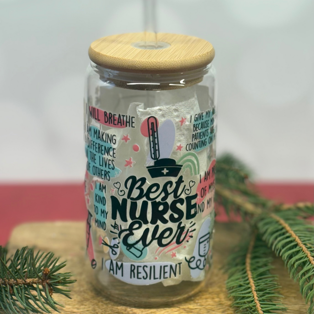 Tumbler with 'Best Nurse Ever' text and wooden lid on a textured surface with greenery.
