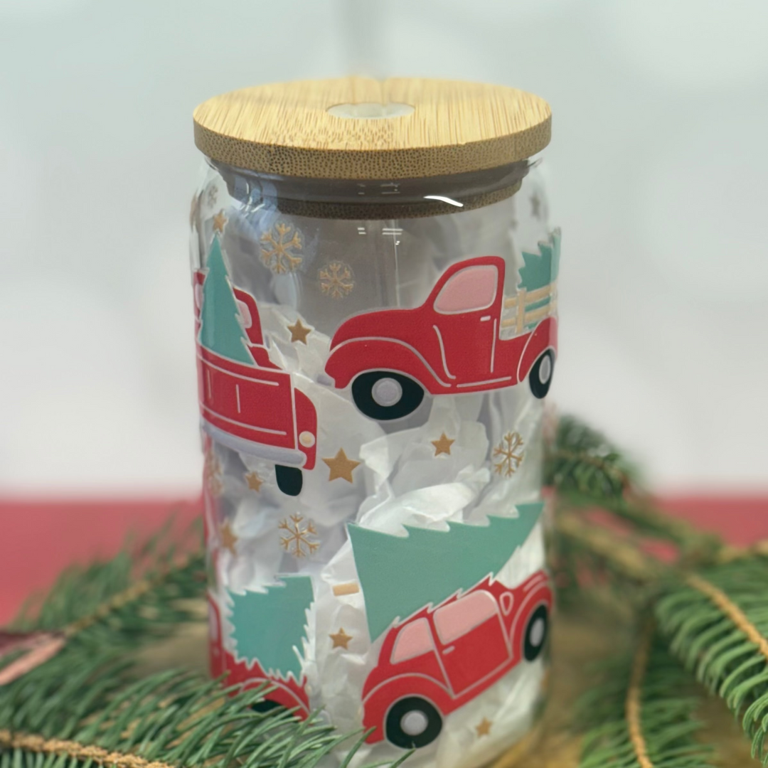 Jar with Christmas-themed design and wooden lid on a light background