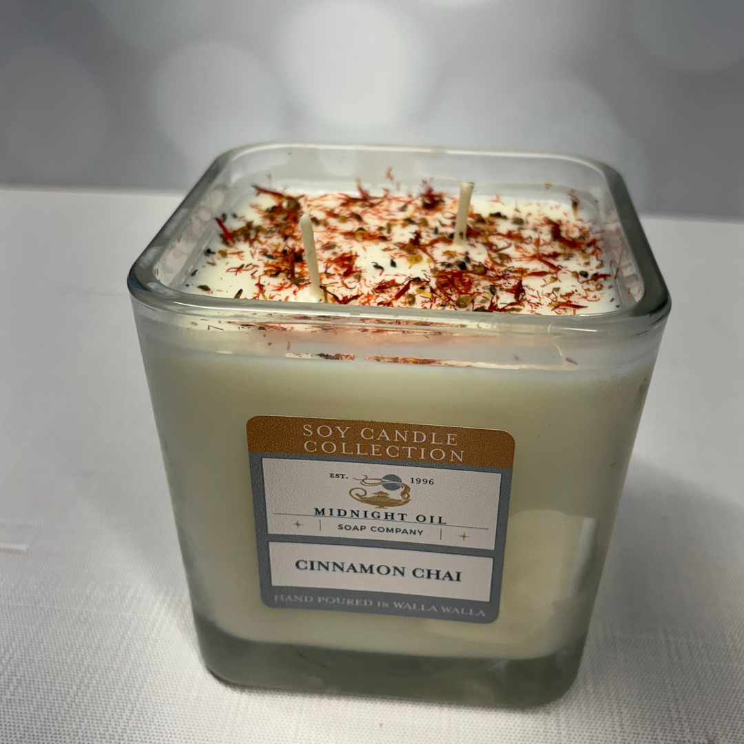 Soy candle in a glass jar with a label on a white background